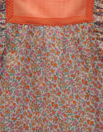 Vestido de niña con flores naranjas