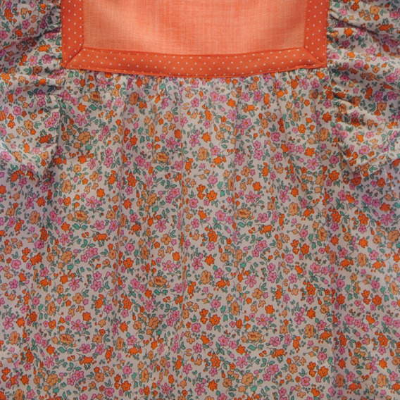 Vestido de niña con flores naranjas